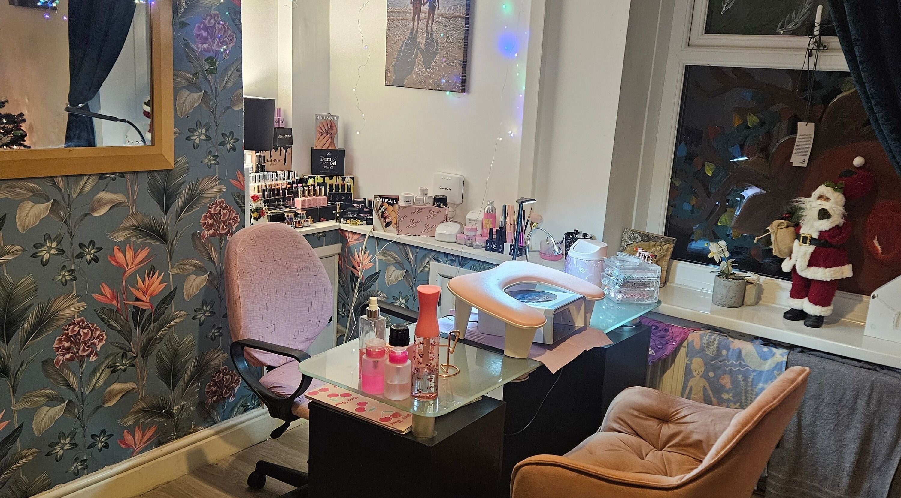 Cozy nail station at Kawaii Nails in Neath, Wales, GB with festive decor and nail products.