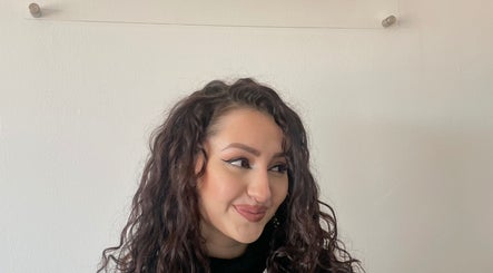 Elegant curly hairstyle at Kimiko Hair Studio, Pretoria, Gauteng, ZA, showcasing expert styling and beauty.