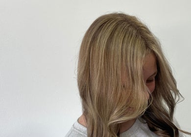 Stylish blonde hairstyle at Kimiko Hair Studio, Pretoria, Gauteng, ZA showing smooth waves and highlights.