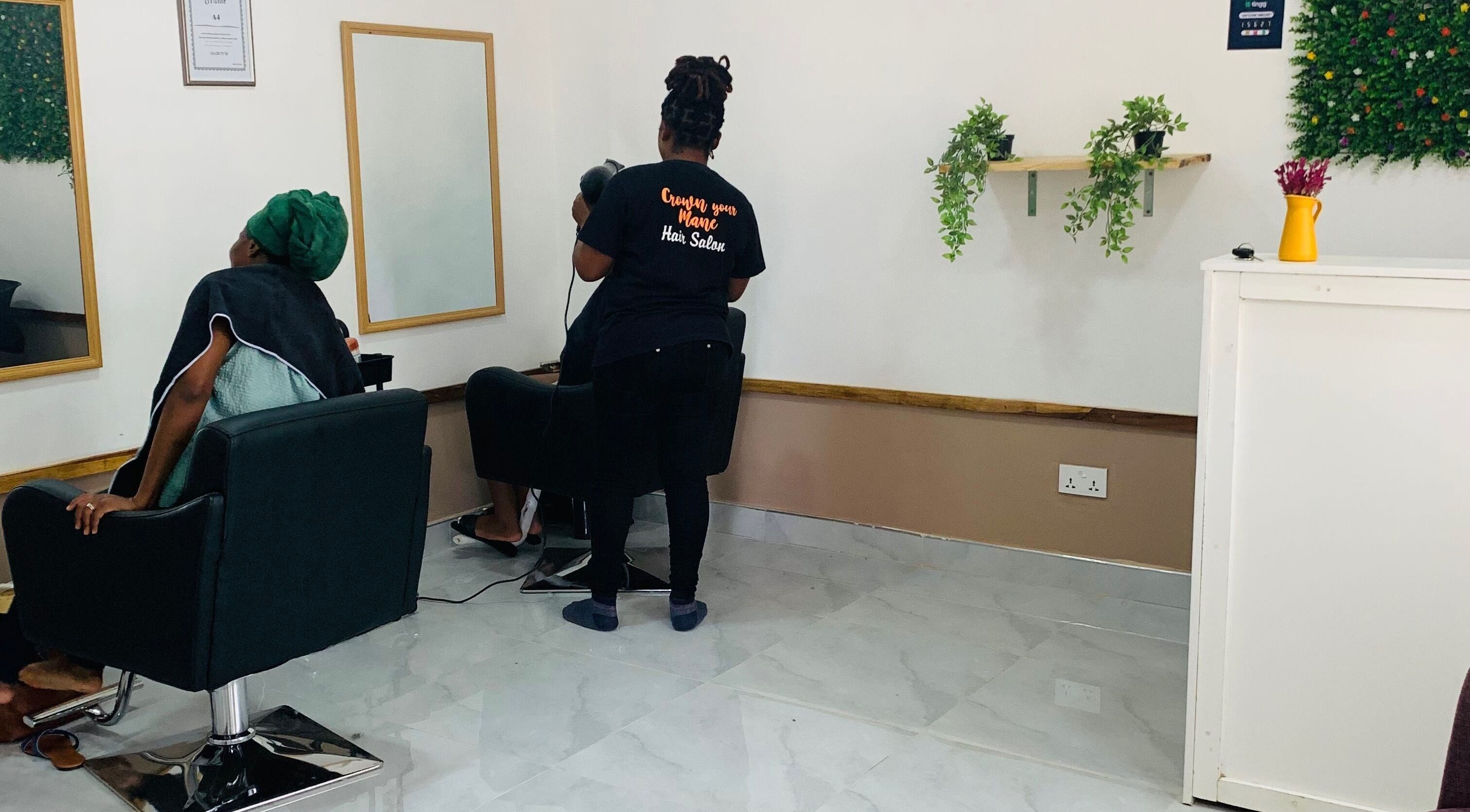 Client receiving a hair treatment at Crown Your Mane, Lusaka, Lusaka Province, ZM.