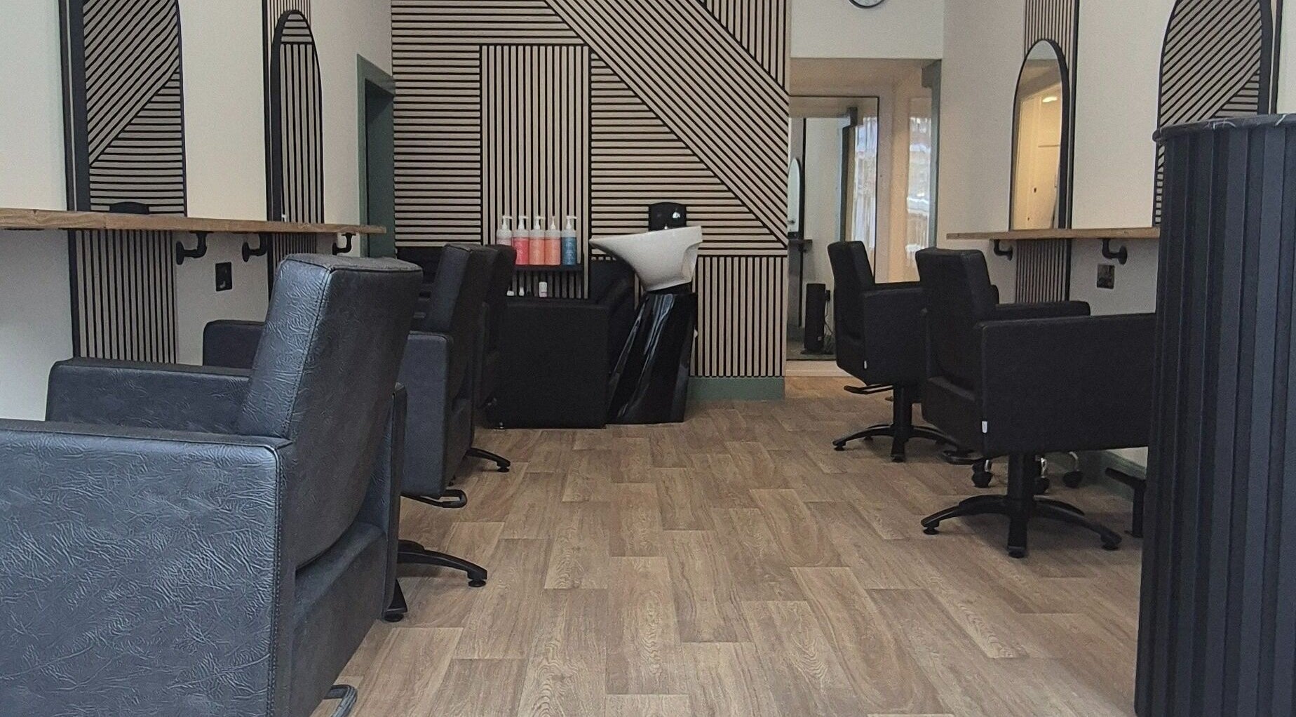 Modern salon at Capelli, Edinburgh, Scotland, GB with sleek chairs and stylish decor.