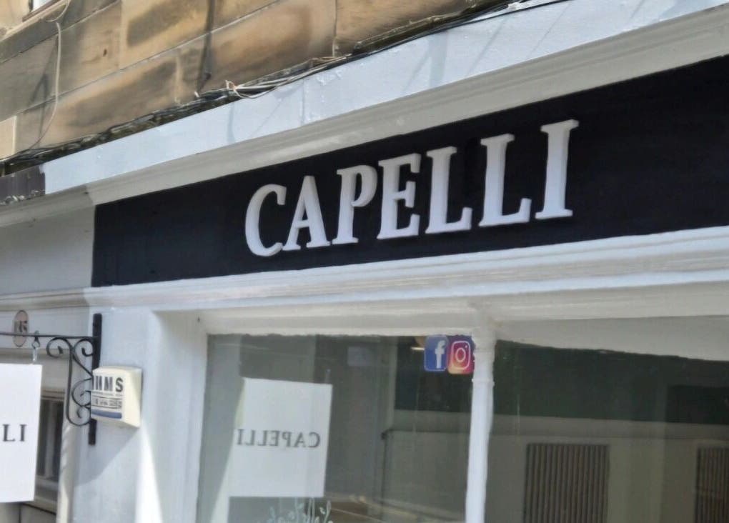 Front view of Capelli salon signage in Edinburgh, Scotland, GB.