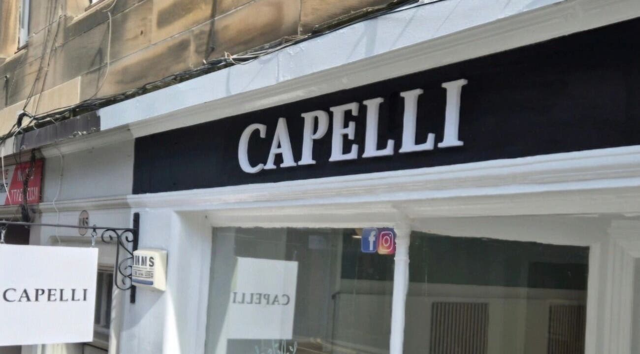 Front view of Capelli salon signage in Edinburgh, Scotland, GB.
