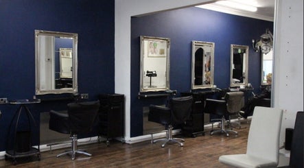 Chic salon interior at The Salon Langley Park in Langley Park, England, GB with stylish chairs and mirrors.