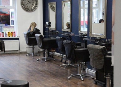 Modern styling chairs and mirrors at The Salon Langley Park in Langley Park, England, GB.