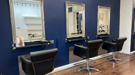 Chic styling chairs and framed mirrors at The Salon Langley Park, Langley Park, England, GB for stylish grooming.