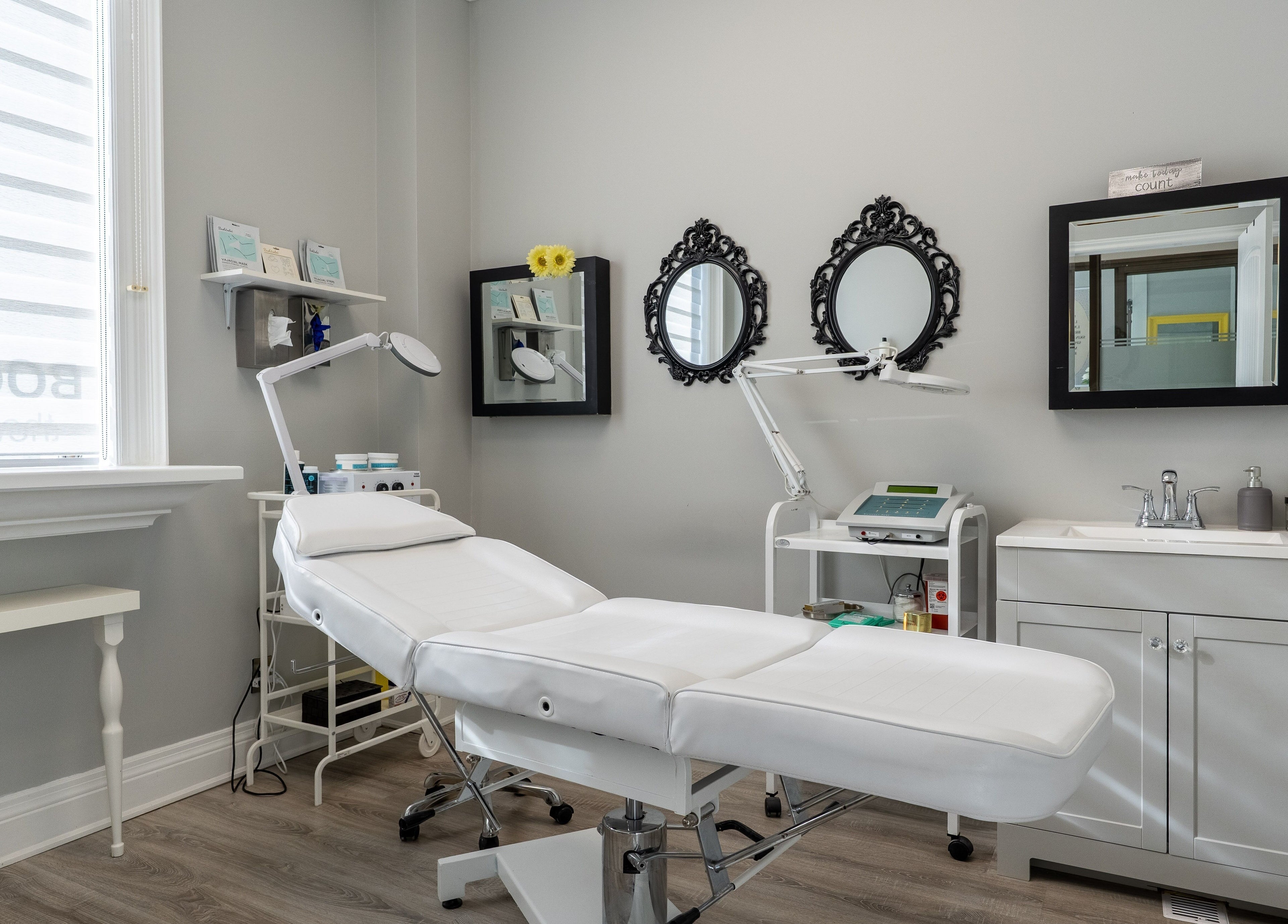 Modern treatment room at The Waxing Strip (Aurora), Aurora, Ontario, CA with a white spa chair and decor.
