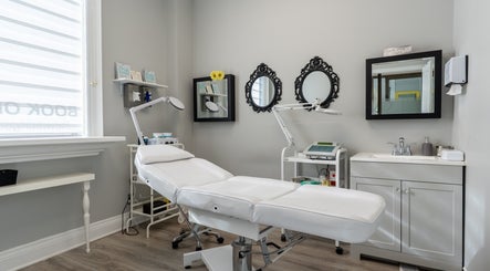 Modern treatment room at The Waxing Strip (Aurora), Aurora, Ontario, CA with a white spa chair and decor.