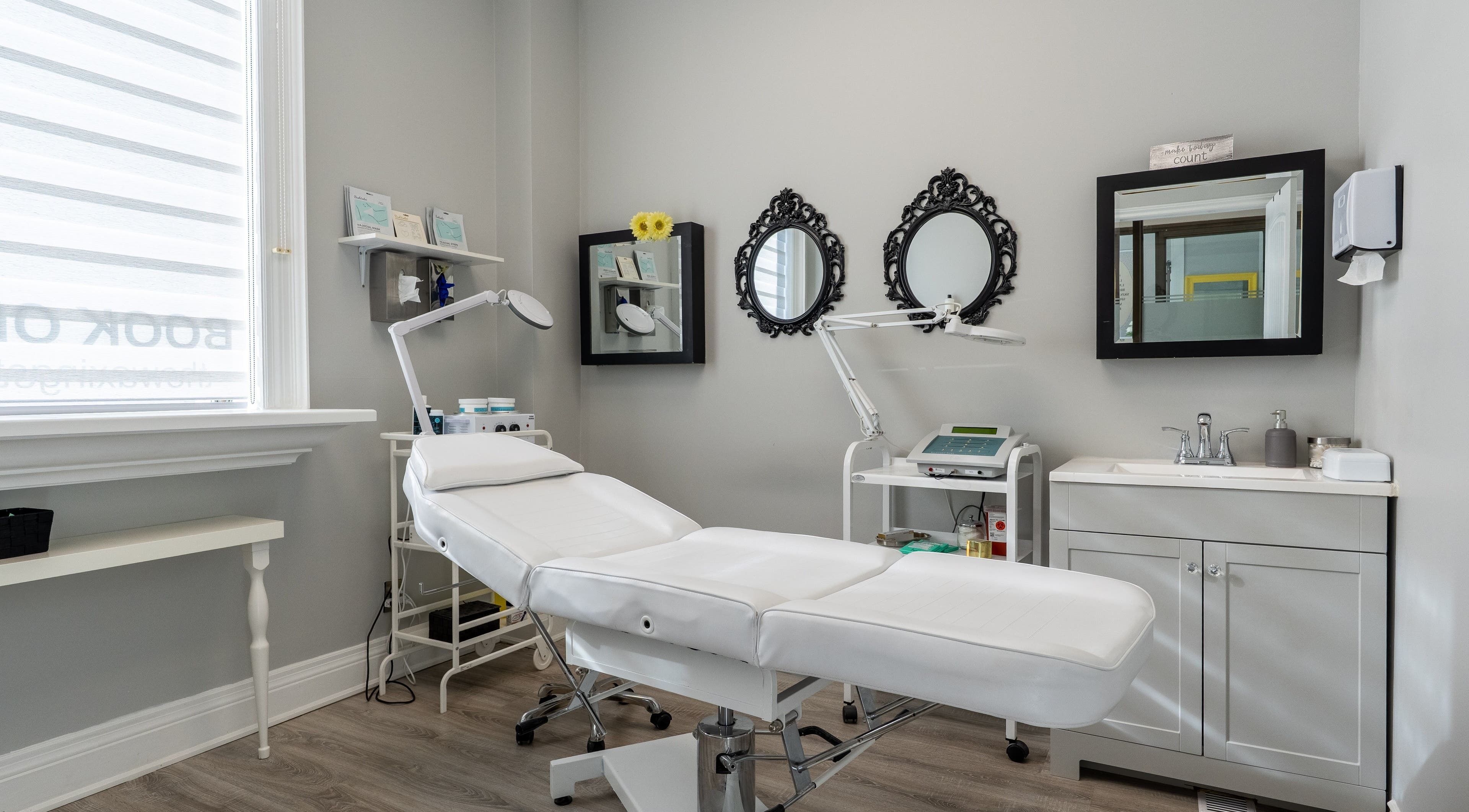 Modern treatment room at The Waxing Strip (Aurora), Aurora, Ontario, CA with a white spa chair and decor.