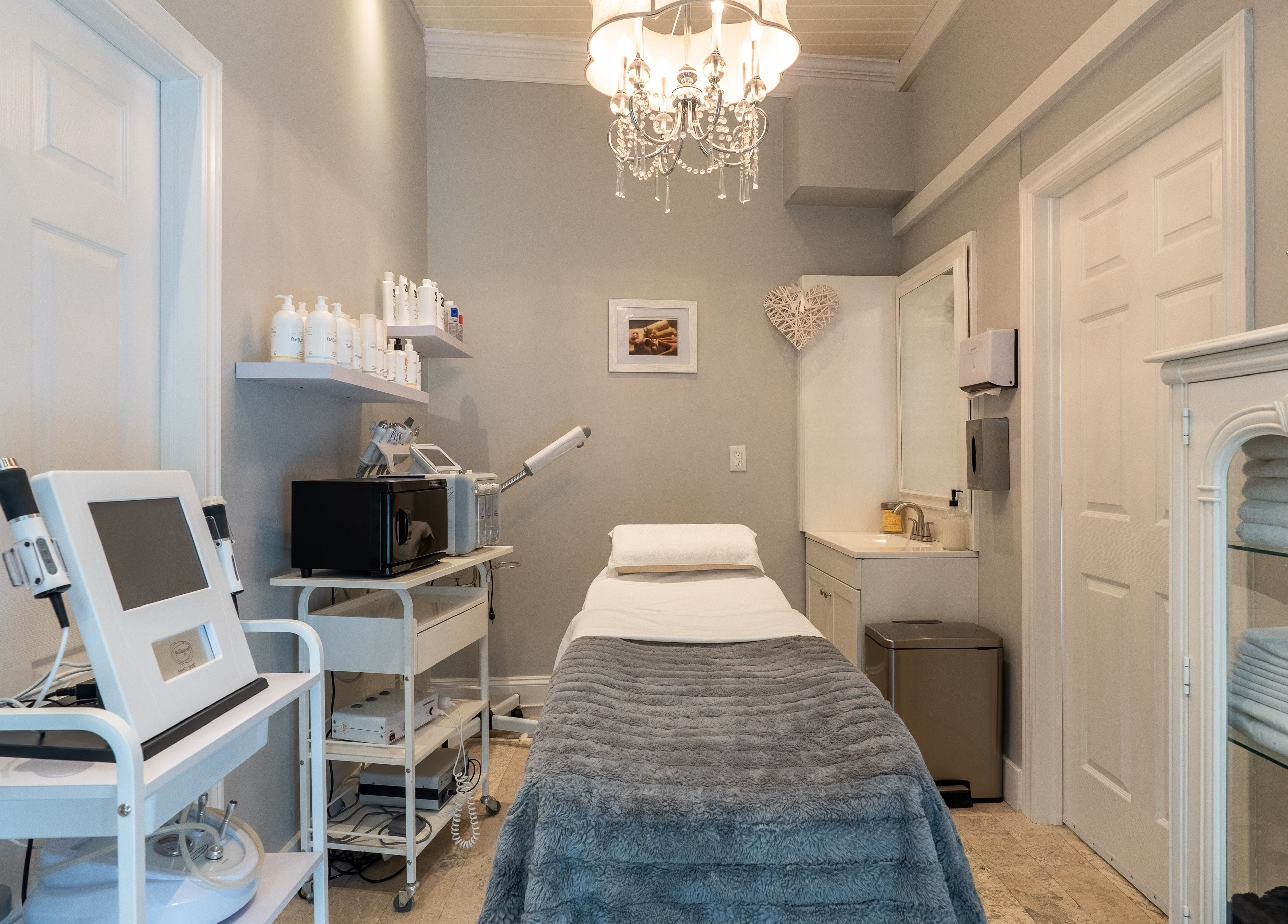 Spacious treatment room at The Waxing Strip (Aurora) in Aurora, Ontario, CA, featuring elegant decor and equipment.