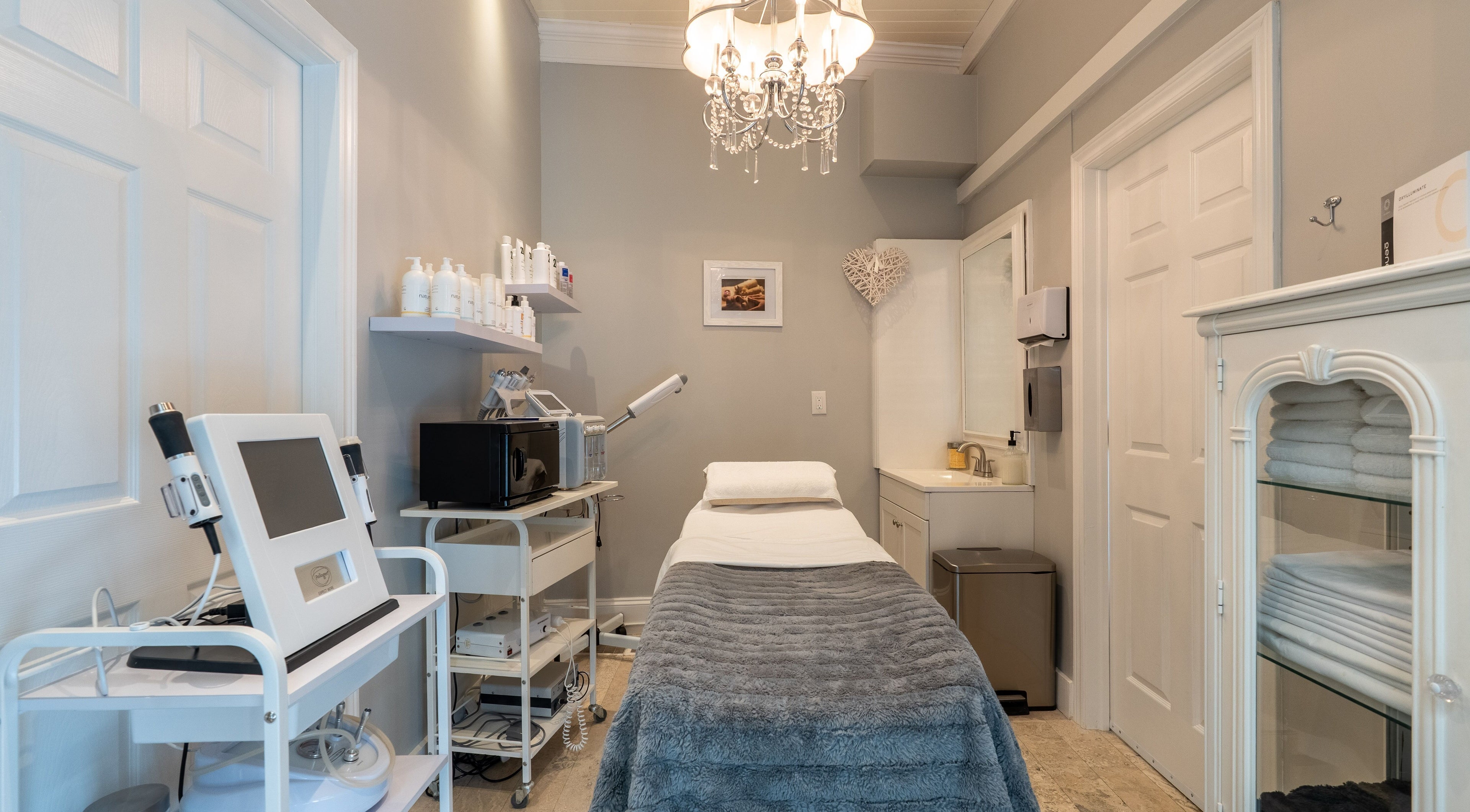 Spacious treatment room at The Waxing Strip (Aurora) in Aurora, Ontario, CA, featuring elegant decor and equipment.