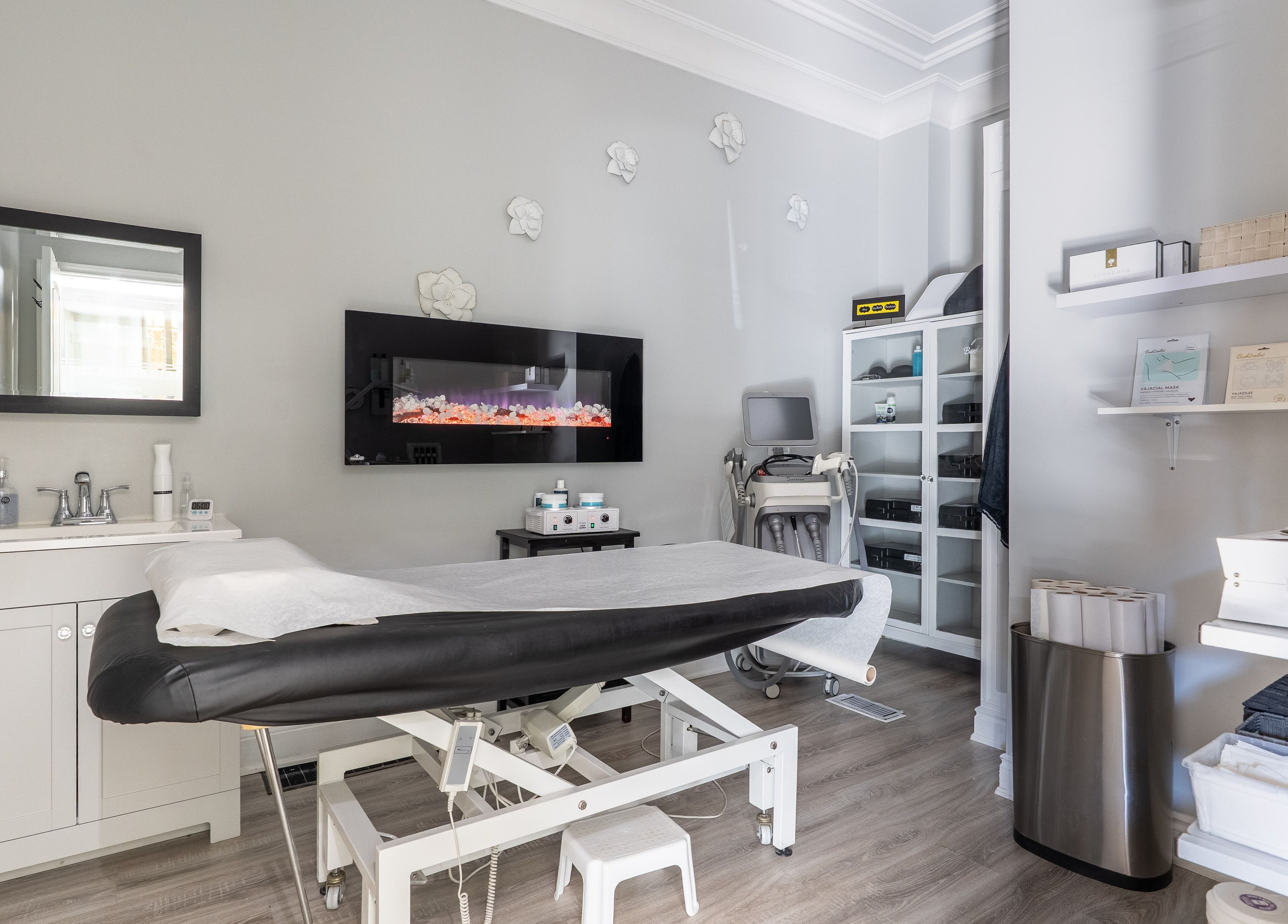 Bright treatment room at The Waxing Strip (Aurora), Aurora, Ontario, CA with spa bed and modern decor.