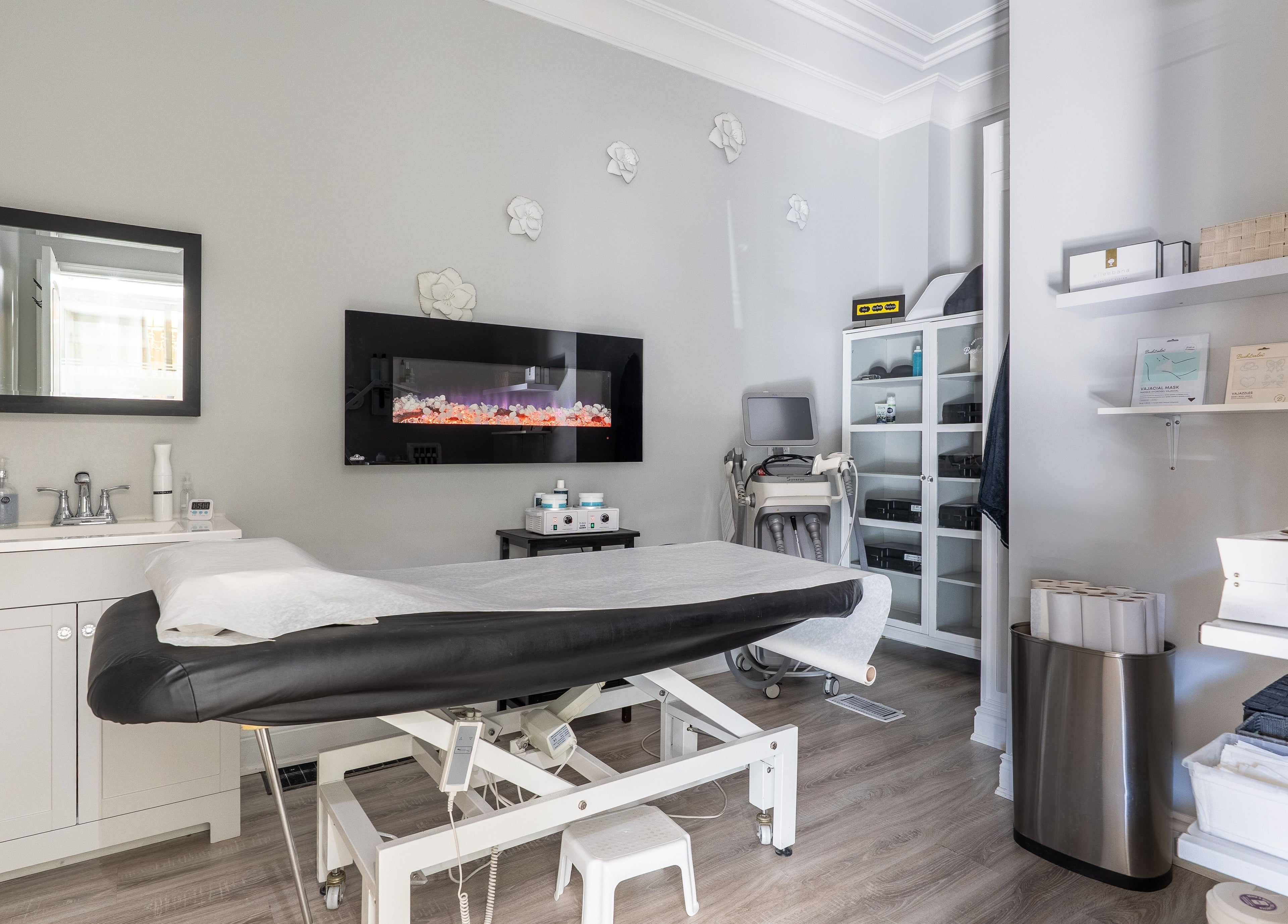 Bright treatment room at The Waxing Strip (Aurora), Aurora, Ontario, CA with spa bed and modern decor.