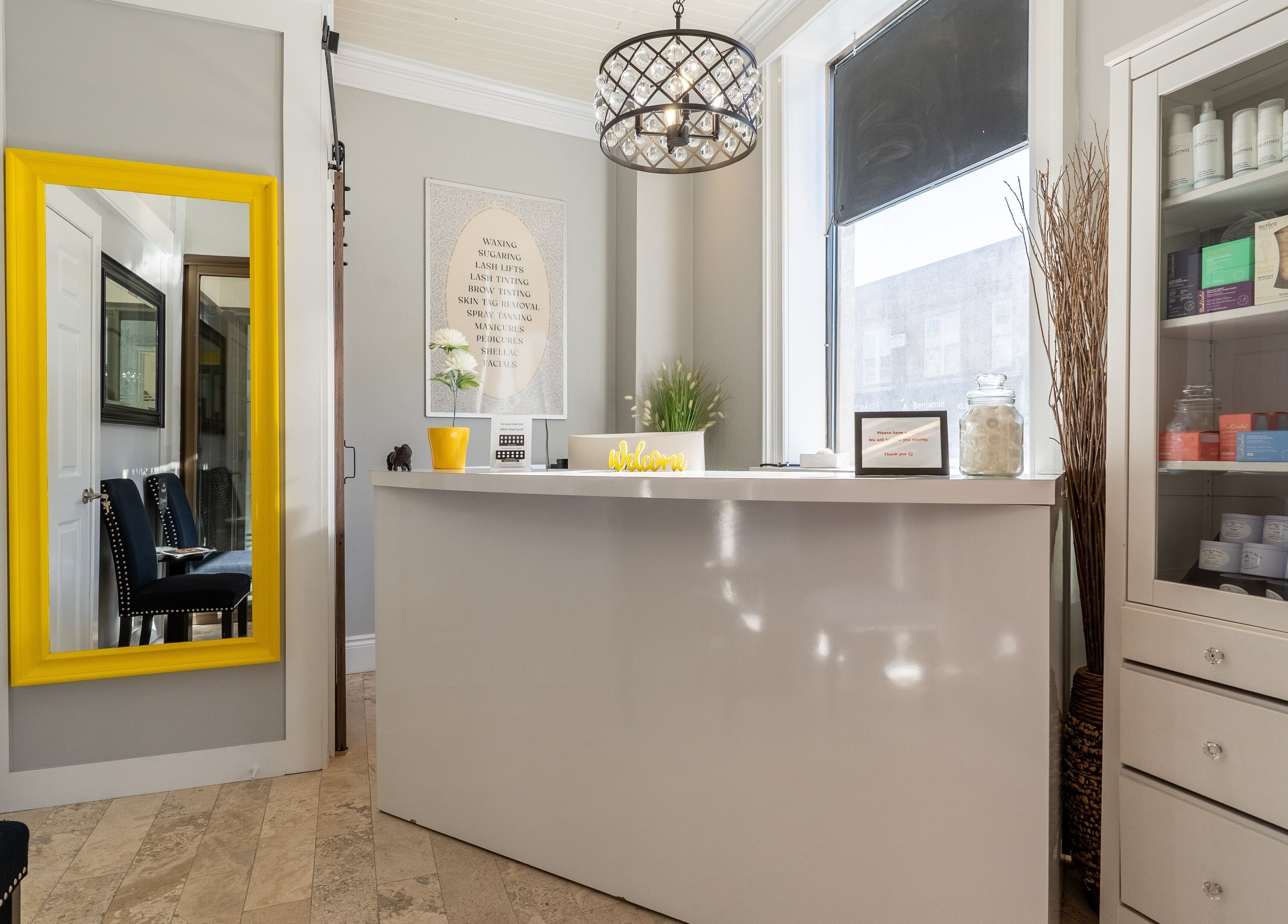 Elegant reception at The Waxing Strip (Aurora) in Aurora, Ontario, CA featuring modern decor and a sunny ambiance.