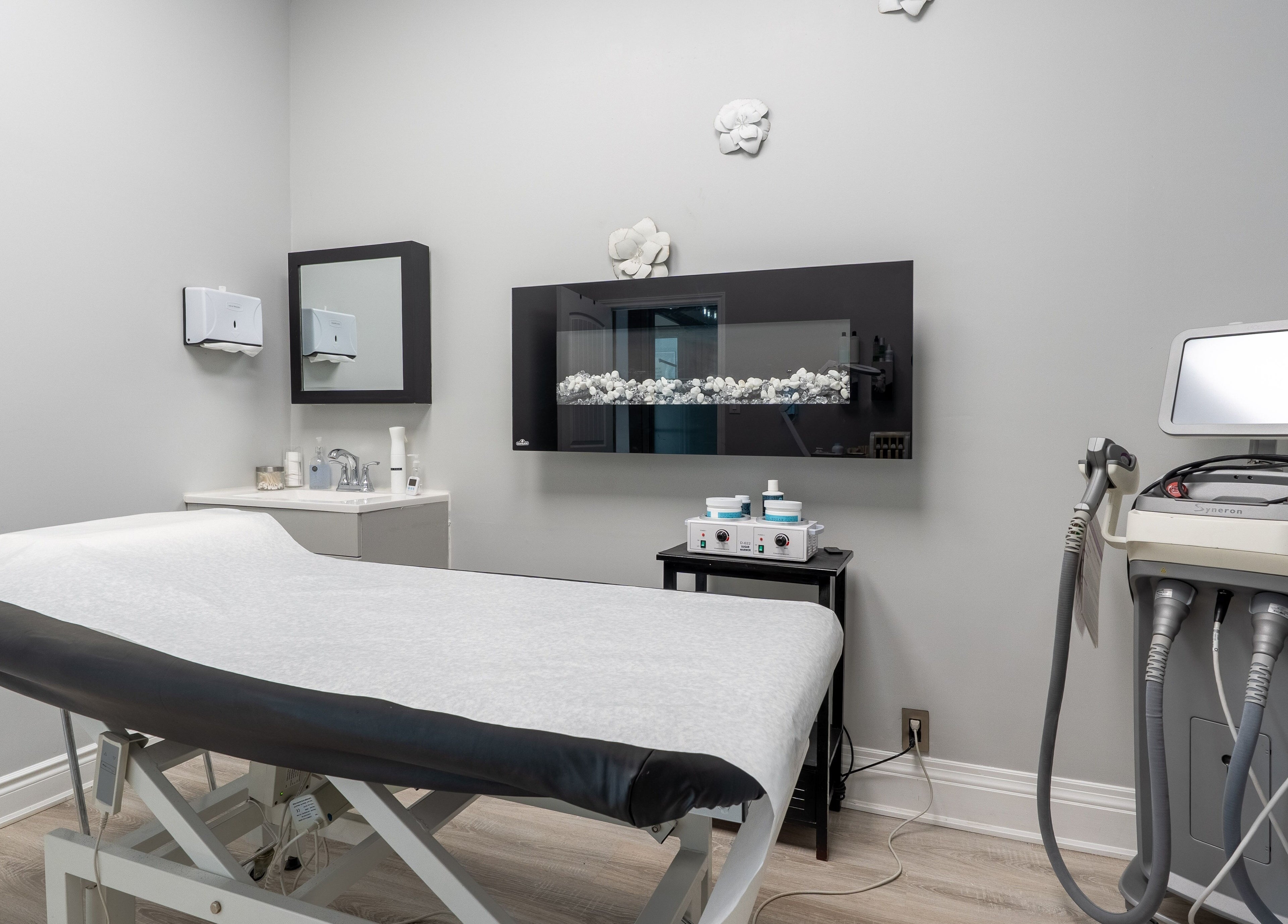 Relaxing treatment room at The Waxing Strip (Aurora), Aurora, Ontario, CA with modern equipment and elegant decor.
