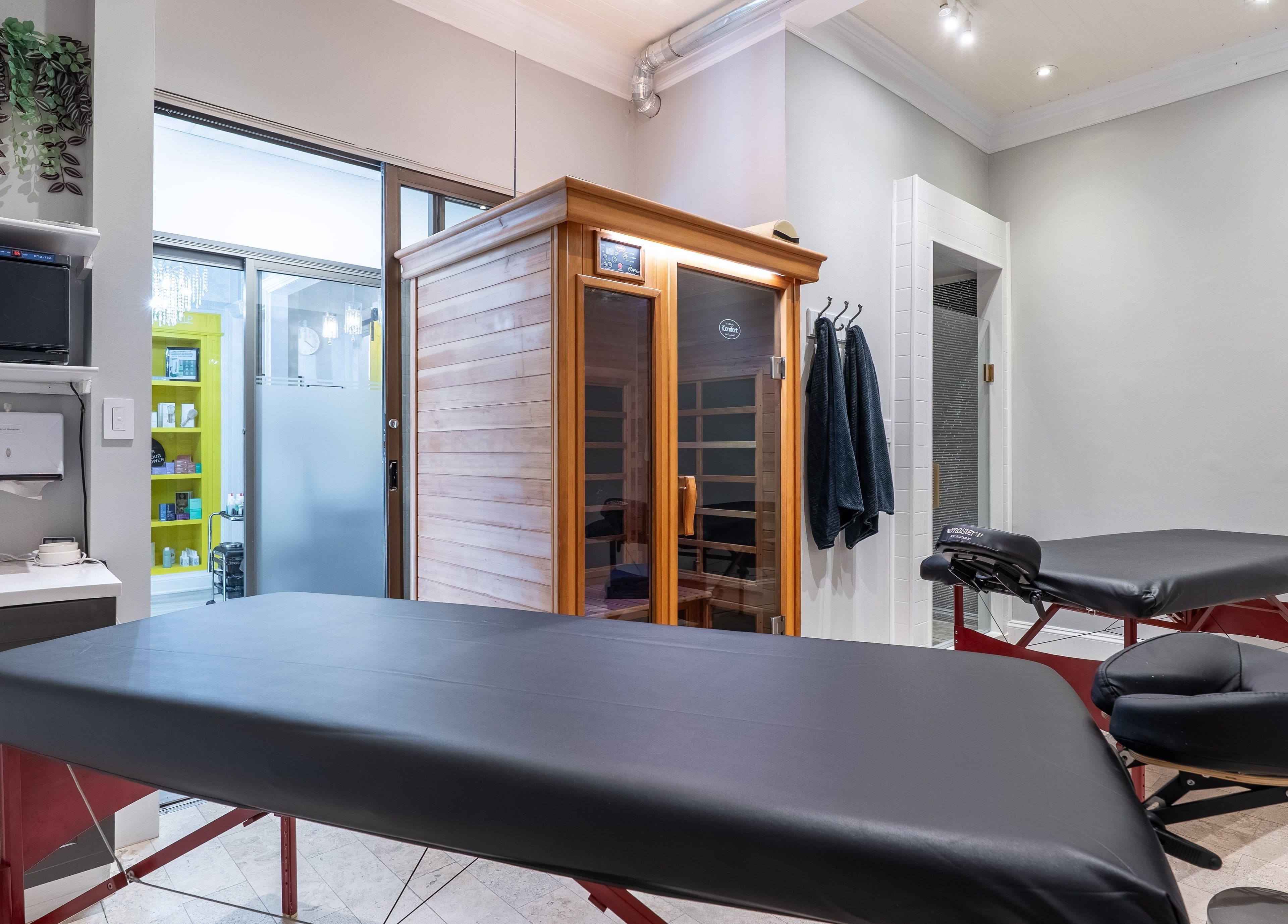 Relaxing spa treatment room at The Waxing Strip (Aurora), located in Aurora, Ontario, CA, featuring modern decor.