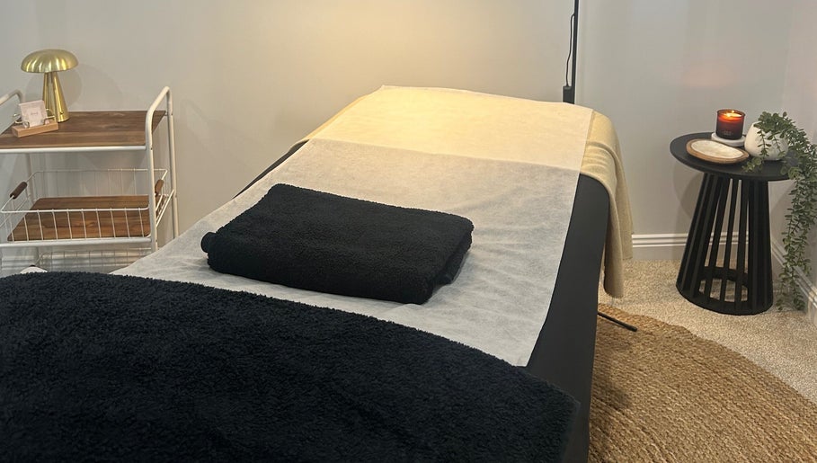 Serene spa room at Beauty By Iona, Jindalee, Western Australia, AU, showcasing a calming massage table setup.