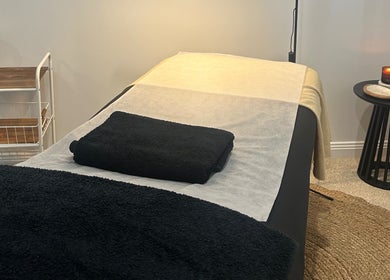 Serene spa room at Beauty By Iona, Jindalee, Western Australia, AU, showcasing a calming massage table setup.
