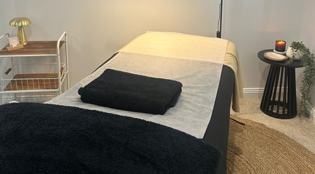 Serene spa room at Beauty By Iona, Jindalee, Western Australia, AU, showcasing a calming massage table setup.