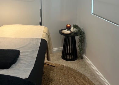 Relaxing spa room at Beauty By Iona, Jindalee, Western Australia, AU, featuring a cozy massage bed.