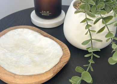 Serene setting with plant and candle at Beauty By Iona, Jindalee, Western Australia, AU.