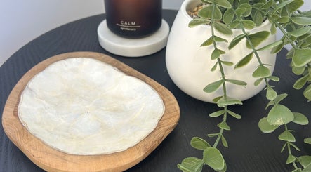 Serene setting with plant and candle at Beauty By Iona, Jindalee, Western Australia, AU.