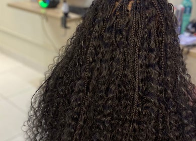 Intricate braided hairstyle at Esperance Beauty Bar in East London, Eastern Cape, ZA, showcasing detailed craftsmanship.