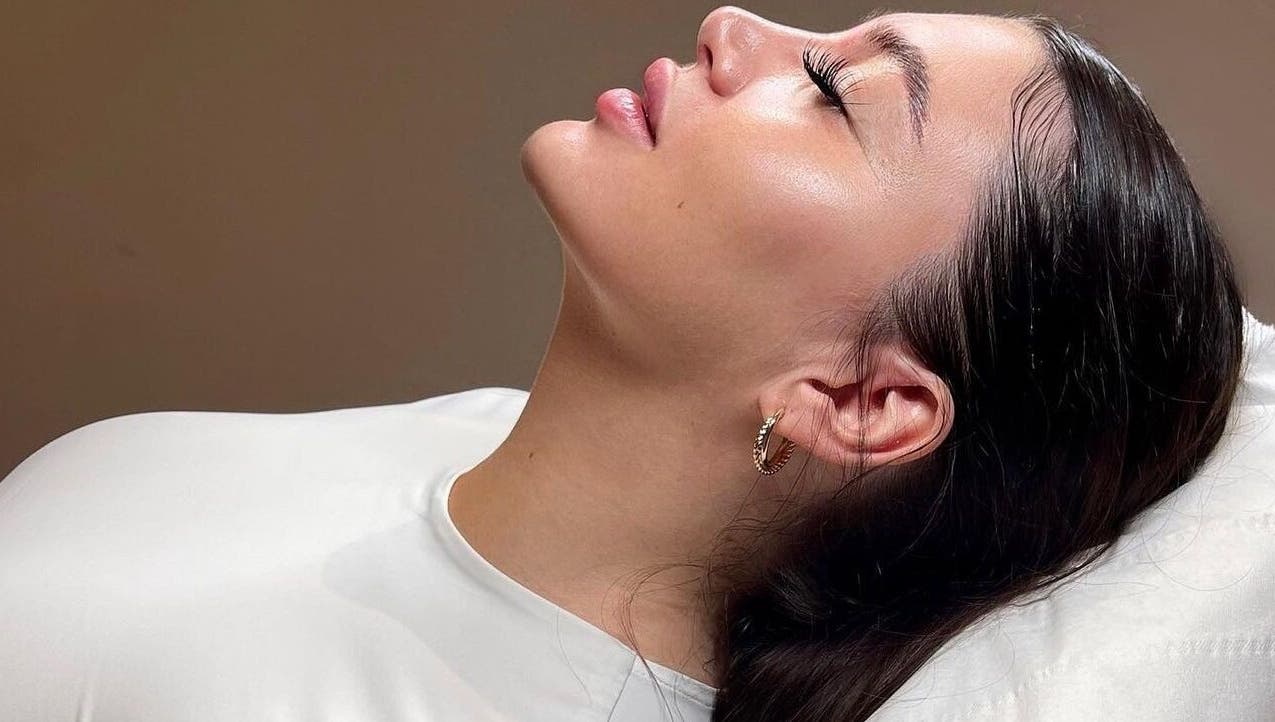 A serene woman enjoying a beauty treatment at Fill&bo, Bournemouth, England, GB, exuding relaxation and bliss.