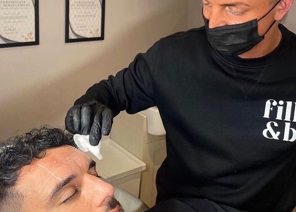 Expert administering skincare treatment at Fill&bo, Bournemouth, England, GB.