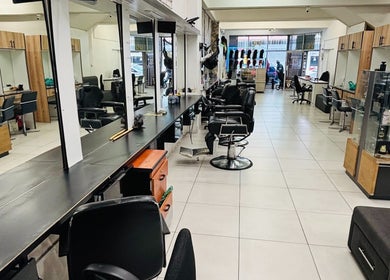 Interior of LAVISH LOOKS HAIR STUDIO in Cape Town, Western Cape, ZA, showcasing modern styling stations.