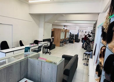 Modern interior of LAVISH LOOKS HAIR STUDIO in Cape Town, Western Cape, ZA featuring stylish seating and décor.