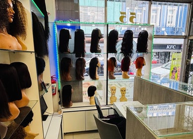 Wigs on display at LAVISH LOOKS HAIR STUDIO, Cape Town, Western Cape, ZA, showcasing various styles.