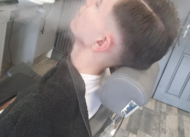 Relaxing steam treatment at RA FADE BARBERS, London, England, GB, enhancing the grooming experience.