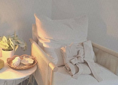 Relaxing spa lounge chair with soft light at Santara Thai Wellness, Salford, England, GB.