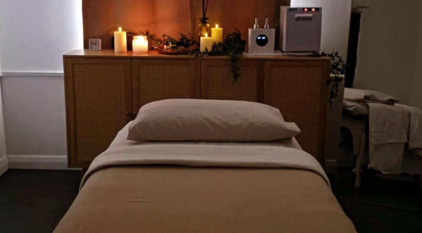 Cozy massage room with candles at Santara Thai Wellness, Salford, England, GB.