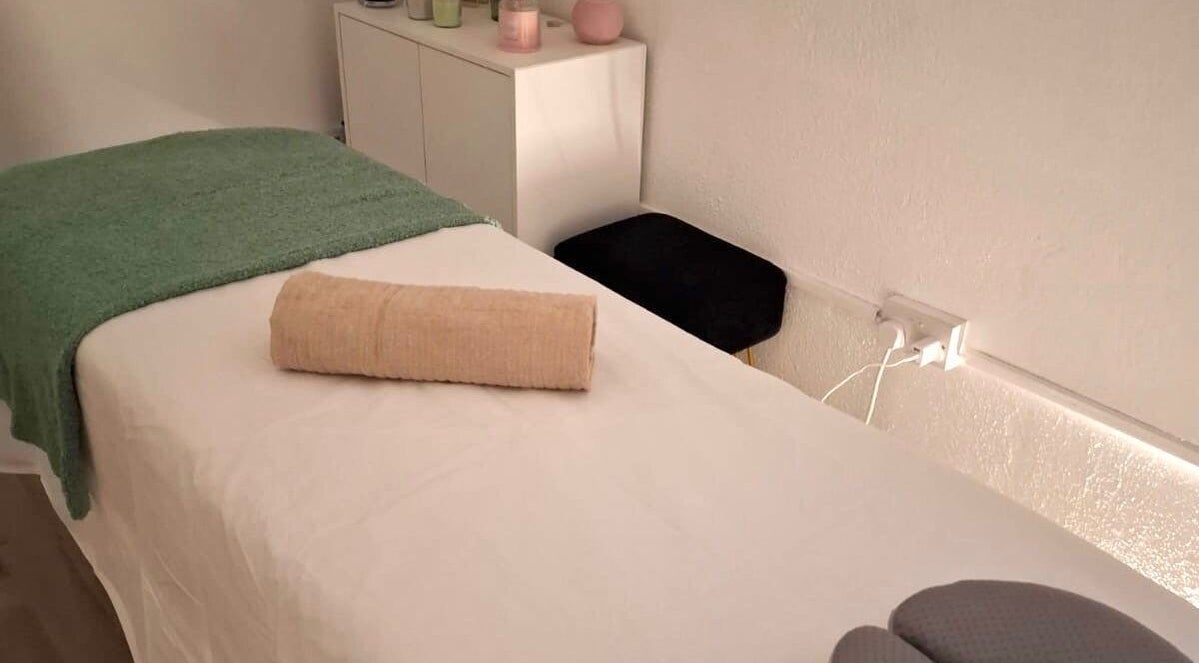 Relaxing massage table setup at Lucy's Spa, Dublin, County Dublin, IE, with calming ambiance.