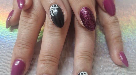 Stylish nail art with purple and black polish at Beauty By Aine, Athlone, County Roscommon, IE.