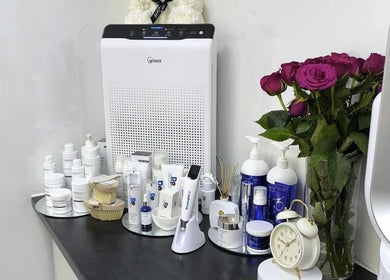 Aesthetic Cosmetology Clinic, Aberdeen, Scotland GB: Skincare products and roses on a counter.