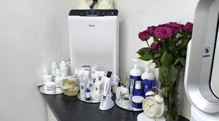 Aesthetic Cosmetology Clinic, Aberdeen, Scotland GB: Skincare products and roses on a counter.