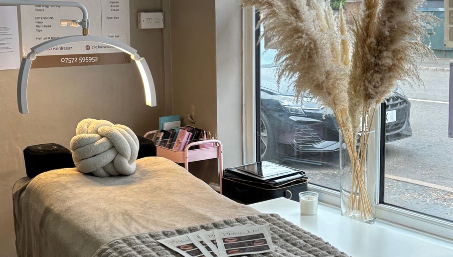 Cozy treatment room at Beauty Bliss, Hartlebury, England, GB, featuring plush decor and soft lighting.