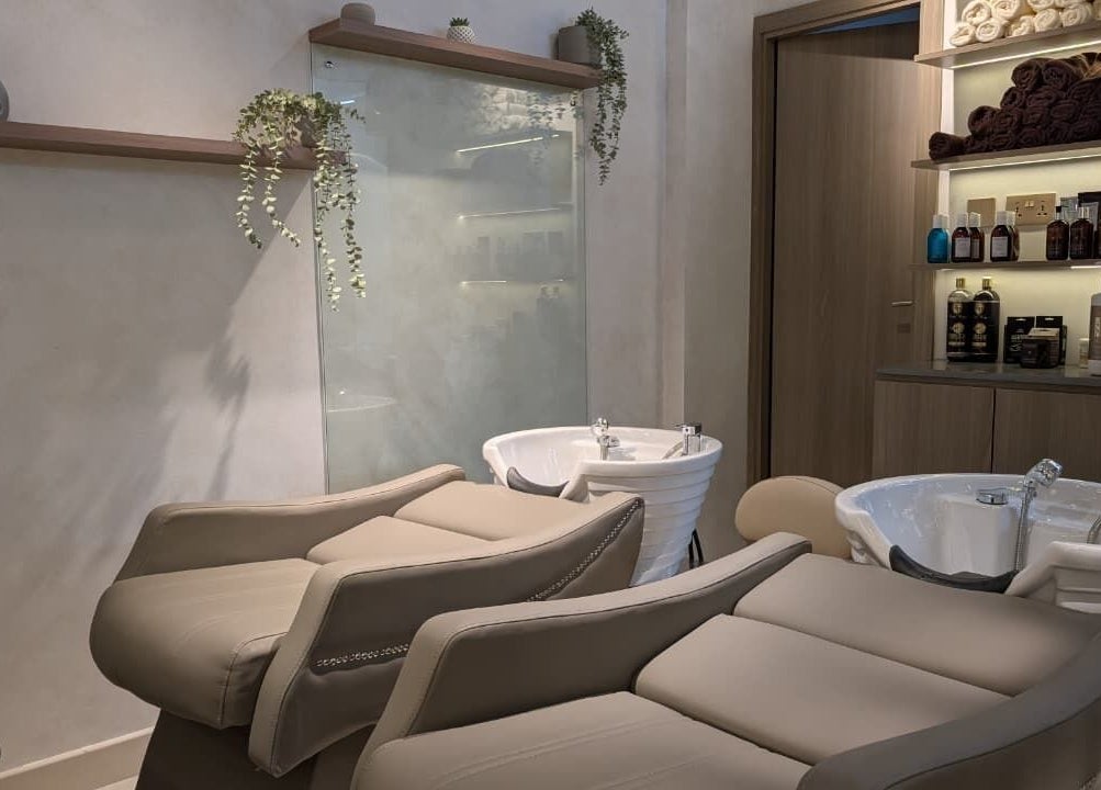 Modern salon wash area at Mystt by Sophia Ladies Salon L.L.C Dubai, AE, featuring plush reclining seats.