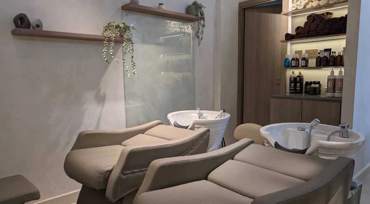 Modern salon wash area at Mystt by Sophia Ladies Salon L.L.C Dubai, AE, featuring plush reclining seats.