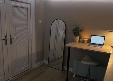 Serene workspace at Silk Touch Tattoos, Colchester, England, showcasing modern decor and soothing ambiance.