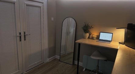 Serene workspace at Silk Touch Tattoos, Colchester, England, showcasing modern decor and soothing ambiance.