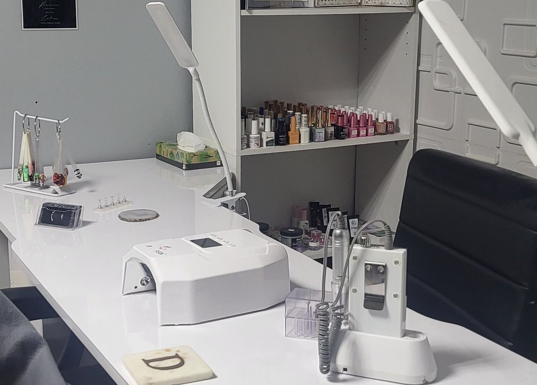 Nail care equipment at Claws by Dee, Cabo Rojo, PR showcasing organized workspace and polish collection.
