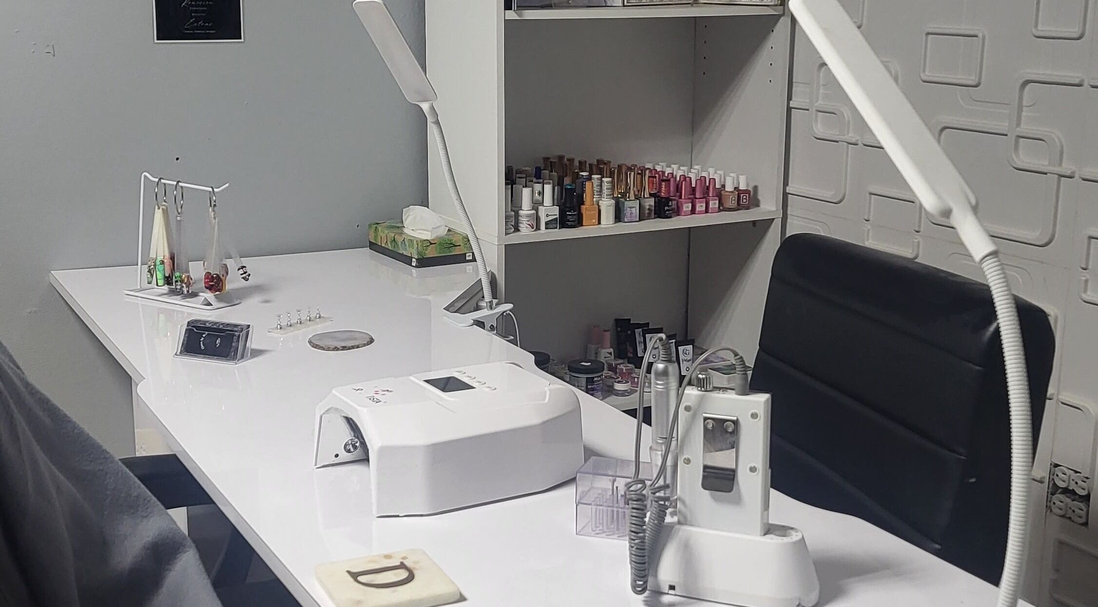 Nail care equipment at Claws by Dee, Cabo Rojo, PR showcasing organized workspace and polish collection.
