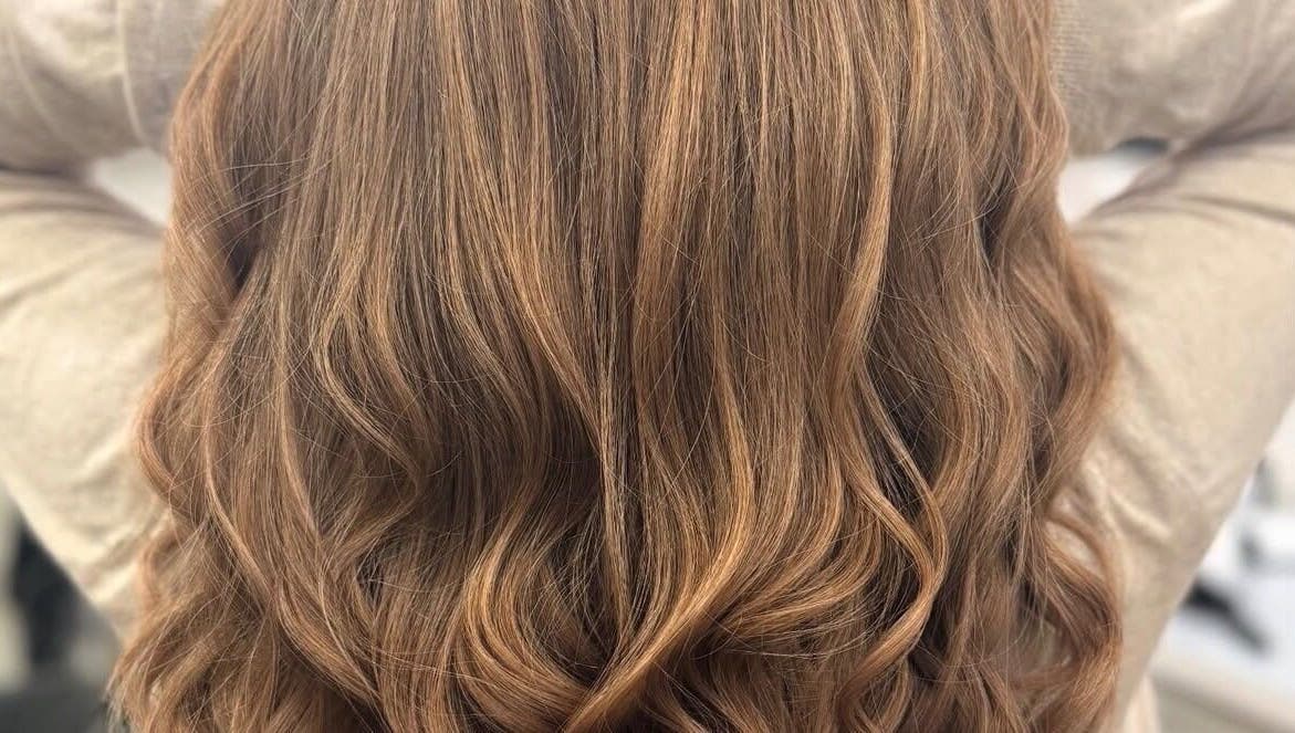 Elegant wavy hairstyle at Nova - Hair in Coulsdon, England, GB. Perfect for vibrant looks and everyday style.