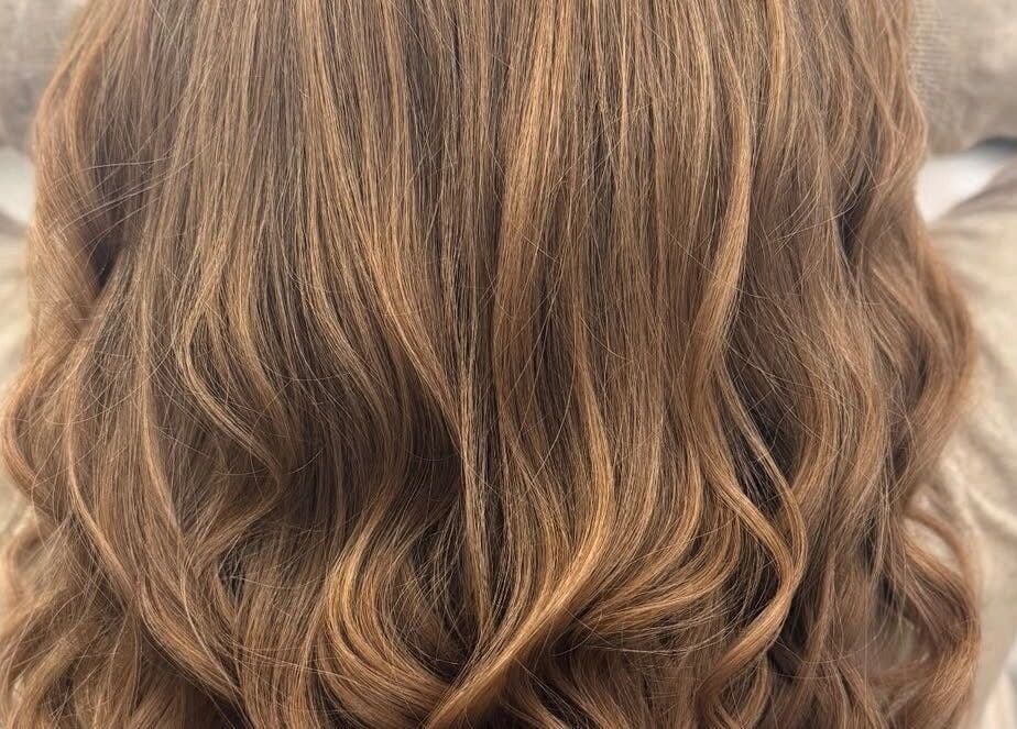 Elegant wavy hairstyle at Nova - Hair in Coulsdon, England, GB. Perfect for vibrant looks and everyday style.