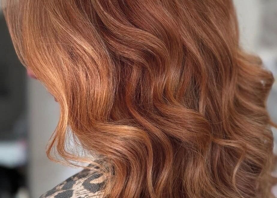 Lustrous copper waves styled at Nova - Hair, Coulsdon, England, GB for a radiant look.