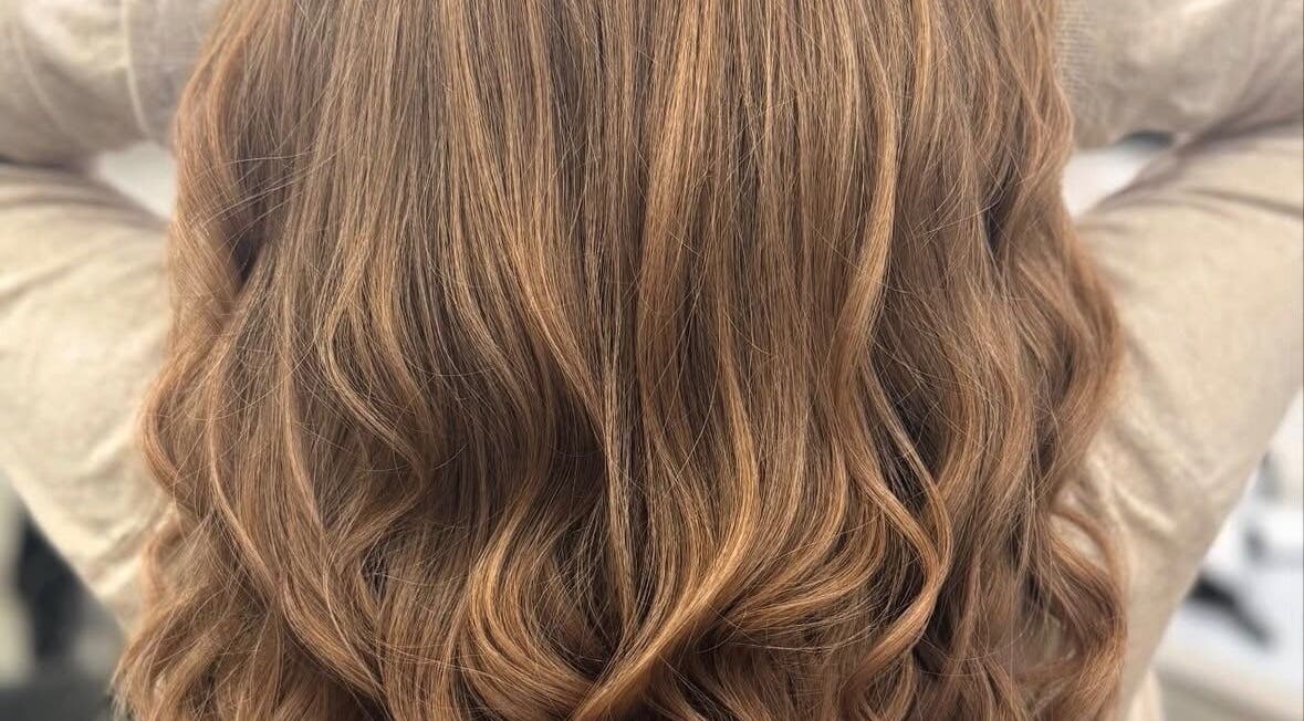 Flowing golden waves hairstyle at Nova - Hair, Coulsdon, England, GB, showcasing luxurious curls.